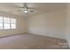 Spacious bedroom with neutral carpeting and large window at 5601 Fairview Rd # 22, Charlotte, NC 28209