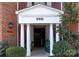 Elegant building entrance with columns and landscaping at 5601 Fairview Rd # 22, Charlotte, NC 28209
