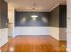 Bright dining room features hardwood floors and a modern light fixture at 5601 Fairview Rd # 22, Charlotte, NC 28209