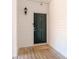 Private entrance with dark green door and wood deck at 5601 Fairview Rd # 22, Charlotte, NC 28209