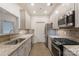 Modern kitchen with granite countertops and stainless steel appliances at 5601 Fairview Rd # 22, Charlotte, NC 28209