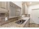 Kitchen sink and granite countertop with tile backsplash at 5601 Fairview Rd # 22, Charlotte, NC 28209