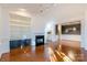 Living room with hardwood floors, fireplace, and built-in shelving at 5601 Fairview Rd # 22, Charlotte, NC 28209