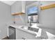 Modern kitchen with white cabinets, a stainless steel sink, and quartz countertops at 611 Clarinda St, Rock Hill, SC 29730