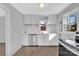 Modern kitchen with white cabinets, stainless steel appliances, and quartz countertops at 611 Clarinda St, Rock Hill, SC 29730