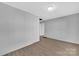 Spacious living room with light gray walls and wood-look floors at 611 Clarinda St, Rock Hill, SC 29730