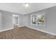 Living room with gray walls, wood-look flooring, and access to other rooms at 611 Clarinda St, Rock Hill, SC 29730