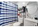 Clean bathroom with shower, toilet and shelving unit at 621 Flint St, Rock Hill, SC 29730