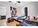 Bright bedroom with two twin beds, wood floors, and a view into the dining area at 621 Flint St, Rock Hill, SC 29730