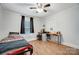 Bedroom with twin bed, desk, and hardwood floors at 621 Flint St, Rock Hill, SC 29730