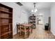 Dining area with wooden table and access to the kitchen at 621 Flint St, Rock Hill, SC 29730