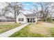 Quaint white house with a porch, yard, and trees at 621 Flint St, Rock Hill, SC 29730