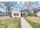 White house with a walkway and mature trees at 621 Flint St, Rock Hill, SC 29730