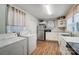 White kitchen with stainless steel appliances and laundry at 621 Flint St, Rock Hill, SC 29730