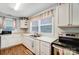 White kitchen with stainless steel appliances and stove at 621 Flint St, Rock Hill, SC 29730