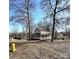 House exterior view, showcasing front yard and trees at 6558 Regatta Ln, Charlotte, NC 28227