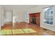 Living room with hardwood floors, fireplace and windows at 6558 Regatta Ln, Charlotte, NC 28227