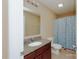 Simple bathroom with granite vanity and shower at 703 Lexington Dr, Albemarle, NC 28001