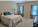 Spacious bedroom with carpeting and two windows at 703 Lexington Dr, Albemarle, NC 28001