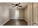 Bright bedroom with ceiling fan and wood-look floors at 830 Richard Ave, Kannapolis, NC 28081