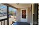 Front porch with wooden railings and a white door at 830 Richard Ave, Kannapolis, NC 28081
