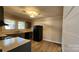 Kitchen with gray cabinets, new appliances, and wood-look floors at 830 Richard Ave, Kannapolis, NC 28081