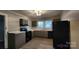 Updated kitchen with gray cabinets and stainless steel appliances at 830 Richard Ave, Kannapolis, NC 28081