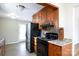 Kitchen with wood cabinets, granite countertops, and black appliances at 937 Kemper Cir, Rock Hill, SC 29732