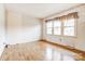 Spacious living room featuring hardwood floors and ample natural light at 10109 Windrift Rd, Charlotte, NC 28215