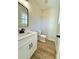 Modern bathroom with white vanity, black fixtures, and new toilet at 1026 N Oakwood St, Gastonia, NC 28052