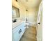 Clean bathroom with white vanity, tub, and black accents at 1026 N Oakwood St, Gastonia, NC 28052