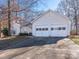 House exterior with double garage and landscaping at 10321 Shelter Rock Ct, Charlotte, NC 28214