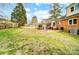 Lush backyard featuring green grass and mature trees, providing a serene outdoor setting at 109 Chanticleer Ct, Charlotte, NC 28214