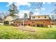 Expansive backyard with a garden plot, patio, and ample space for outdoor activities at 109 Chanticleer Ct, Charlotte, NC 28214