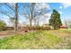 Spacious backyard with a fire pit, perfect for outdoor gatherings and enjoying nature at 109 Chanticleer Ct, Charlotte, NC 28214