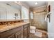 Charming bathroom featuring double vanity, tiled shower with glass door, and ample natural light, creating a relaxing oasis at 109 Chanticleer Ct, Charlotte, NC 28214