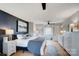 This main bedroom features a dark accent wall, light-colored wood floors, and is brightly lit at 109 Chanticleer Ct, Charlotte, NC 28214