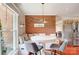 Cozy breakfast nook featuring a round table, banquette seating and brick accent wall at 109 Chanticleer Ct, Charlotte, NC 28214