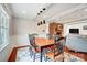 Charming dining area with wooden table, decorative lighting, and views into the living room at 109 Chanticleer Ct, Charlotte, NC 28214