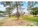 Beautiful property with mature trees surrounding the house, set on a sprawling green lawn at 109 Chanticleer Ct, Charlotte, NC 28214