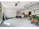 Spacious garage equipped with a workout station, lawn equipment, and ample storage at 109 Chanticleer Ct, Charlotte, NC 28214
