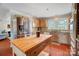 Kitchen featuring stainless steel refrigerator and a wooden island table at 109 Chanticleer Ct, Charlotte, NC 28214