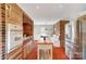 Bright kitchen with brick accents, stainless steel appliances and a breakfast nook at 109 Chanticleer Ct, Charlotte, NC 28214