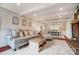 Inviting living room featuring exposed beam ceiling and open layout to the dining area at 109 Chanticleer Ct, Charlotte, NC 28214