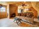 Cozy living room featuring wood paneled ceiling and walls and comfortable furniture at 109 Chanticleer Ct, Charlotte, NC 28214