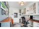 Office featuring built in shelves, hardwood desk and decor at 109 Chanticleer Ct, Charlotte, NC 28214
