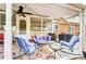 Comfortable patio area furnished with rocking chairs and a love seat, ideal for enjoying the outdoors at 109 Chanticleer Ct, Charlotte, NC 28214