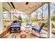 Cozy covered patio with outdoor seating and string lights, perfect for relaxation and entertaining at 109 Chanticleer Ct, Charlotte, NC 28214