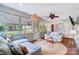Comfortable sunroom featuring large windows and neutral-colored furniture at 109 Chanticleer Ct, Charlotte, NC 28214