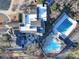 Aerial view of community clubhouse, pool, and surrounding landscape at 12 Woodvine Ln, Clover, SC 29710